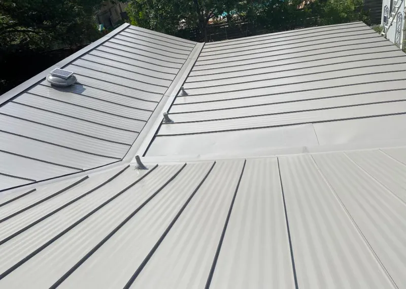 Solar attic fan installed on a metal roof for Roof Ventilation in Monterey